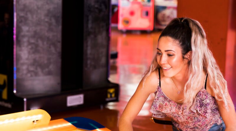 velocity esports, girl playing air hockey